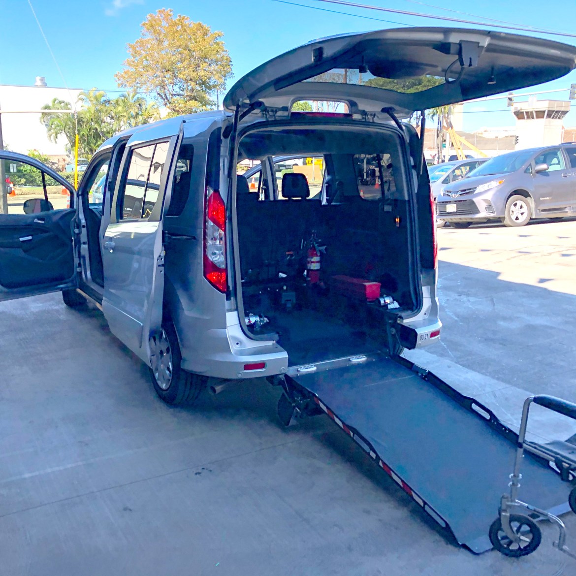 Driverge Ford Transit Connect with the rear-entry, manual ramp deployed